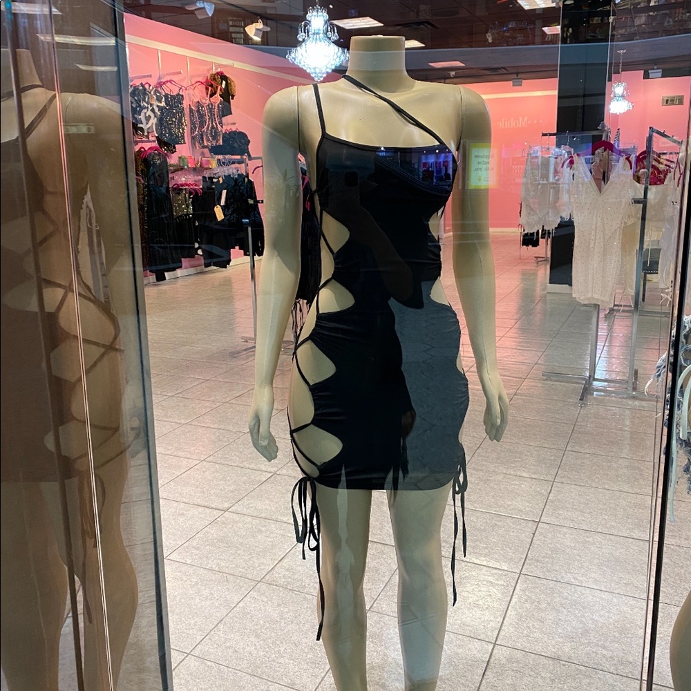 black cut out party dress. has no size tags but can fit a small / medium.